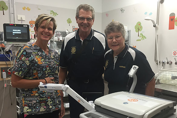 Dr Christa Bell with Graham Cooper and Marion Jones from Southport Rotary Club with the Accuvein and ECG machines purchased for the GCUH Emergency Department through the club's donation.