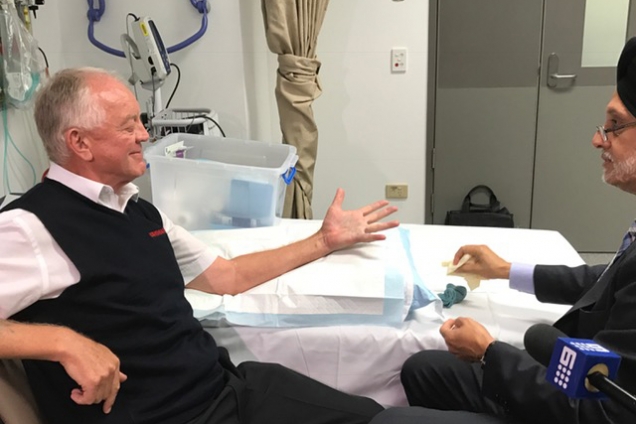 Patient Raymond Harris opens his hand fully after having his contacted finger straightened by Professor Randy Bindra. Patient Raymond Harris opens his hand fully after having his contacted finger straightened by Professor Randy Bindra.