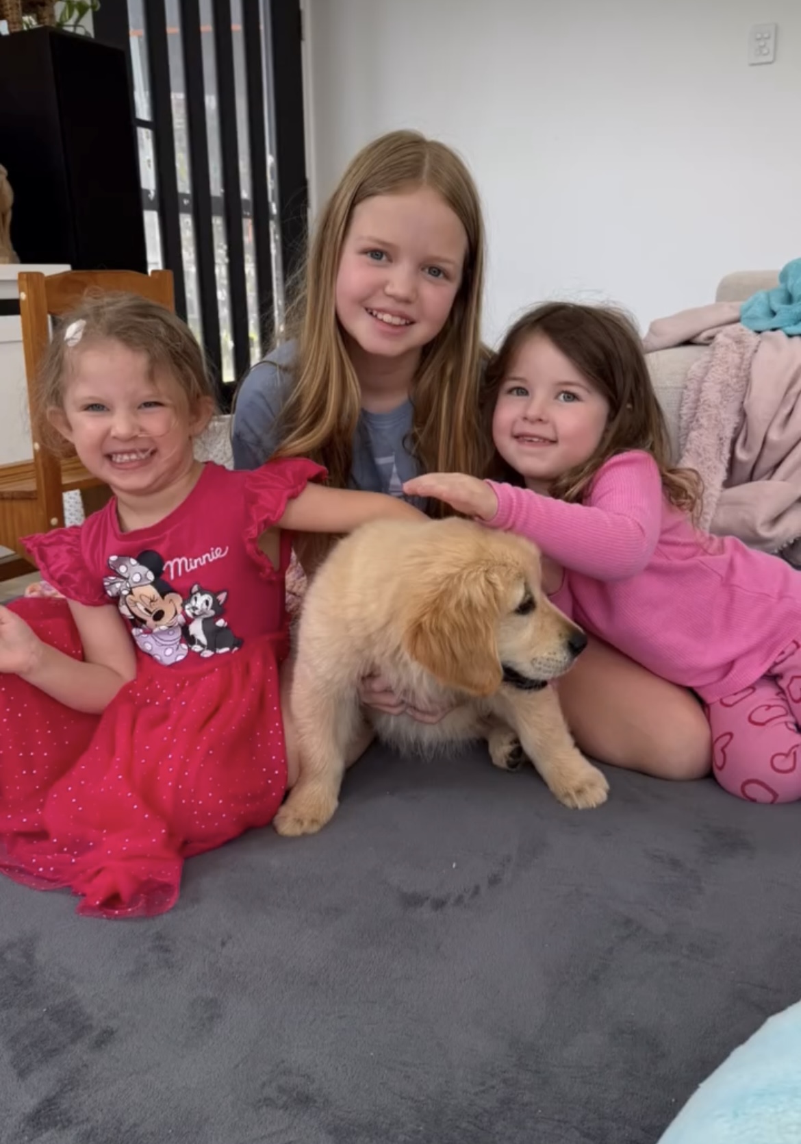 Charlotte with her twin and older sister.