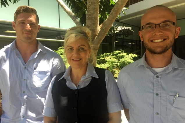 Image of three nursing graduates