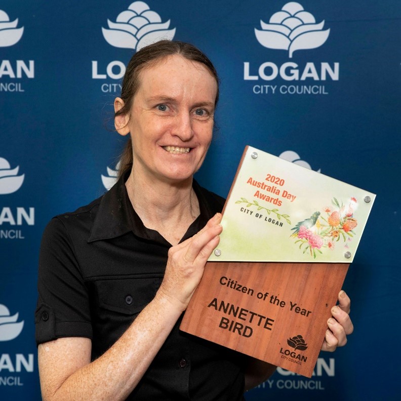 Woman holding award