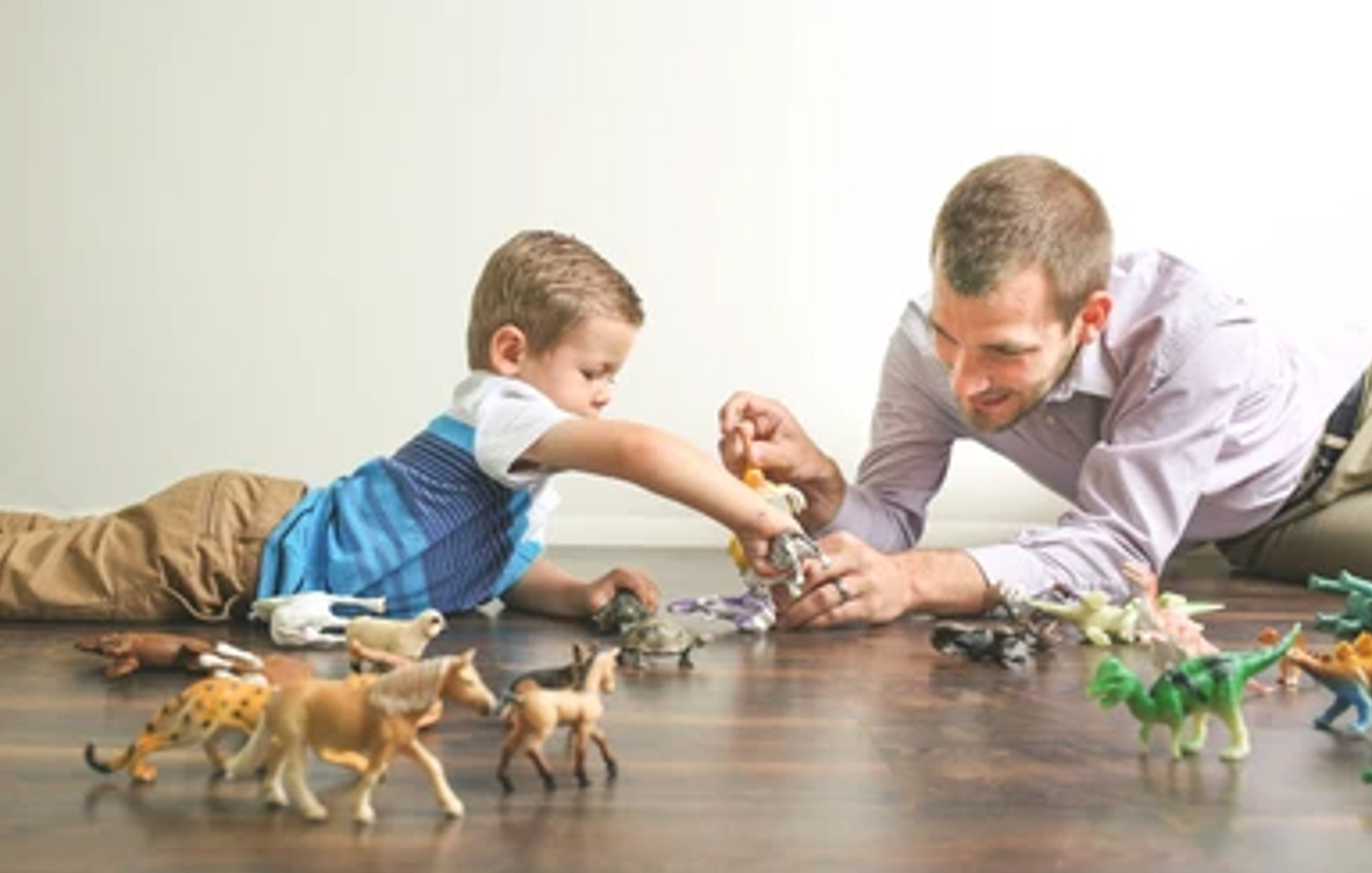 child with dad playing