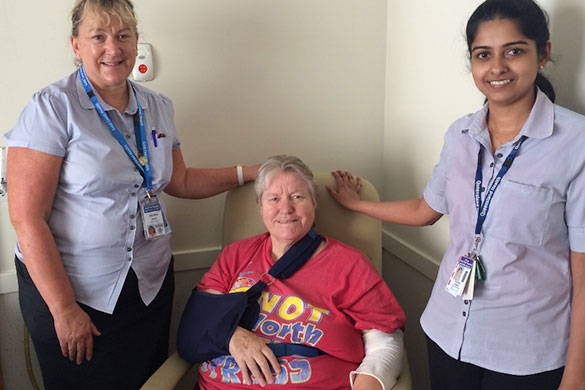 Belinda Davie and Thushara Joseph help patient Norma Lowe settle in to the new ward at Robina Hospital.