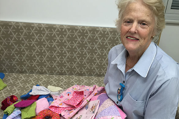 NCU Registered Nurse and Midwife Margaret Alcock welcomes a fresh batch of lovingly crafted donations.