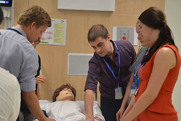 Interns take part in a simulation during their orientation week