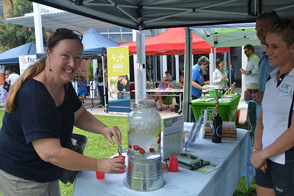 Trisha O'Brien, from the Homeless Health Outreach Team, pauses for a drink at the General Wellness Centre tent. 