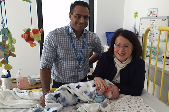 Gold Coast Health Paediatric Surgeons Dr Nada Sudhakaran and Dr Deborah Bailey with one of their little patients, six-month-old Lucas Stephens.